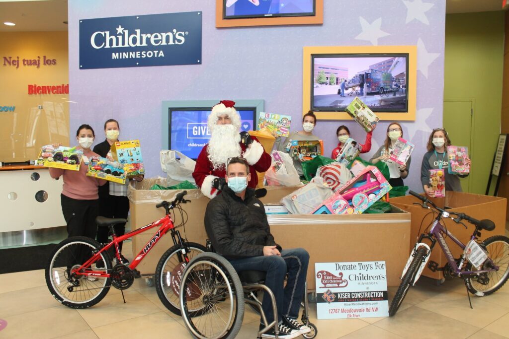dropping off toy donations with children's minnesota staff