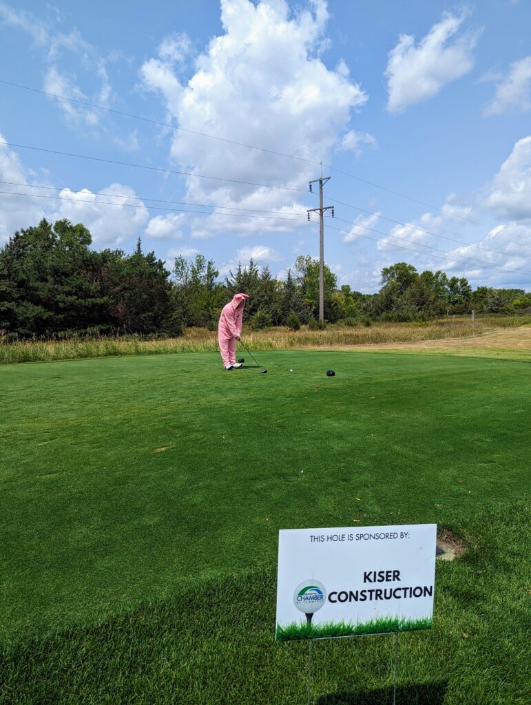a christmas story onesie on the golf course
