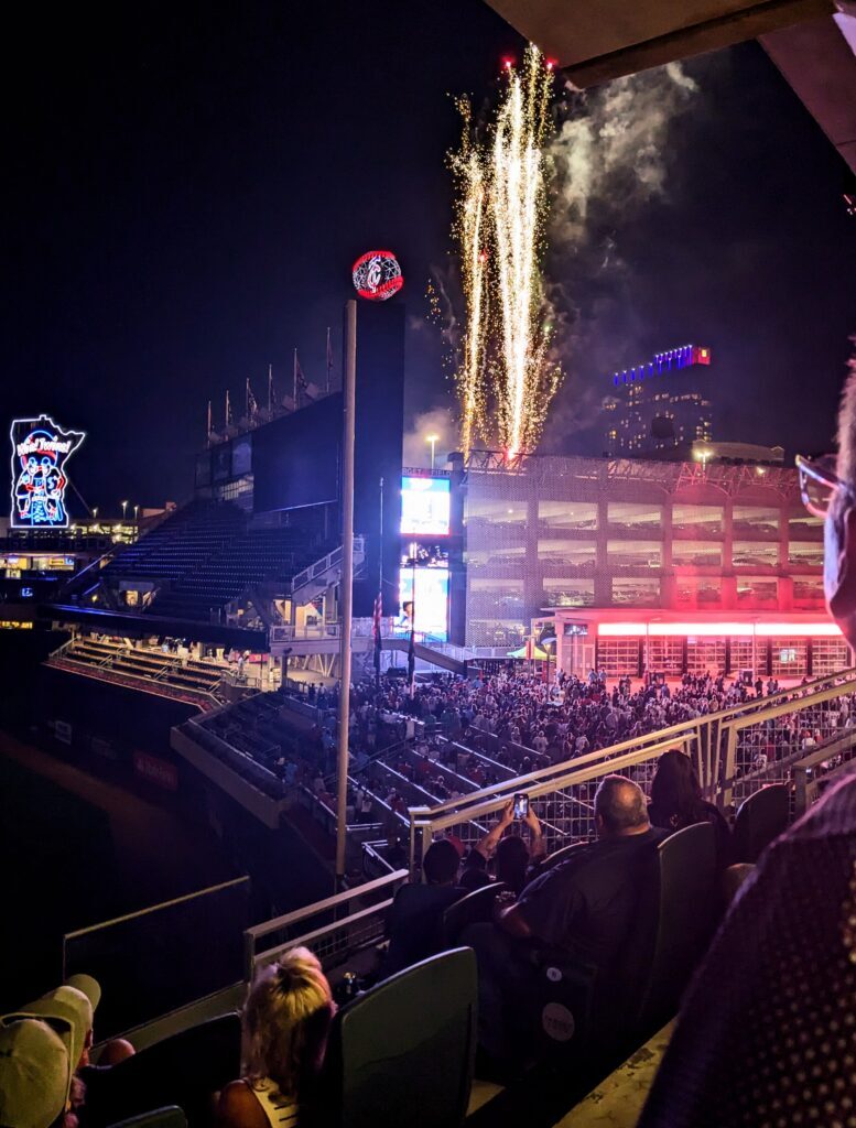 kiser construction crew watching firework show at target field