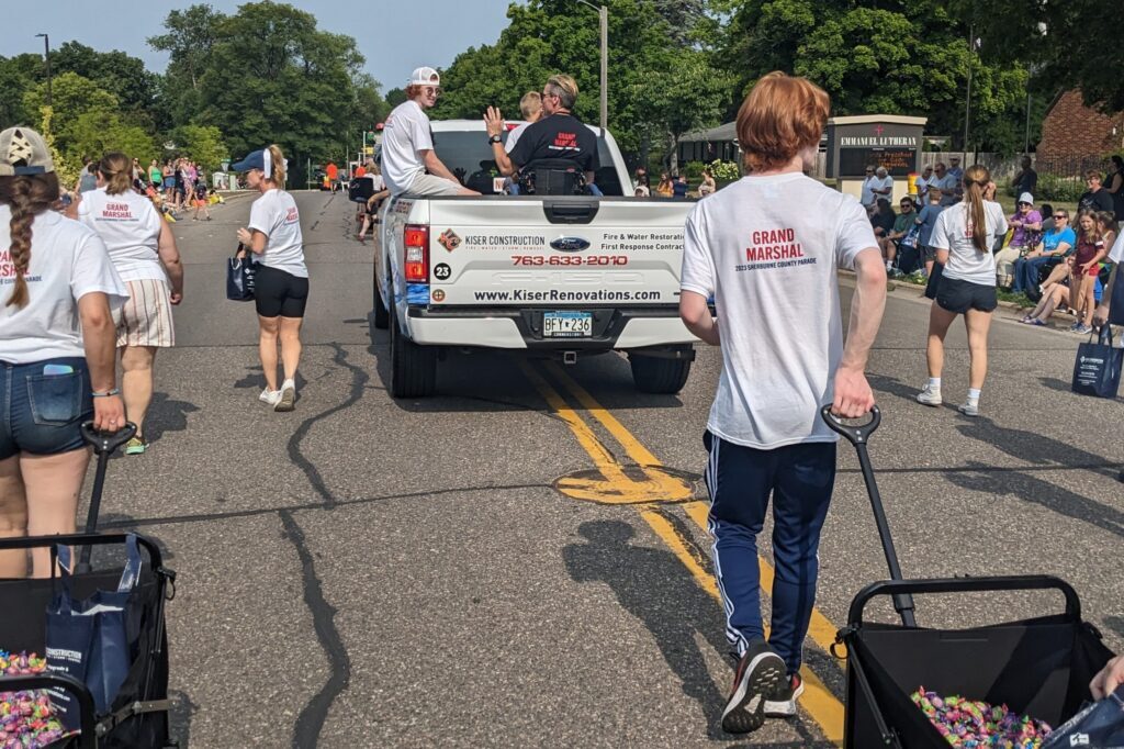kiser construction grand marshal of 2023 sherburne county fair parade